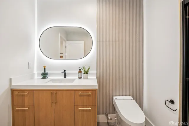 a bathroom with a shower and a glass door