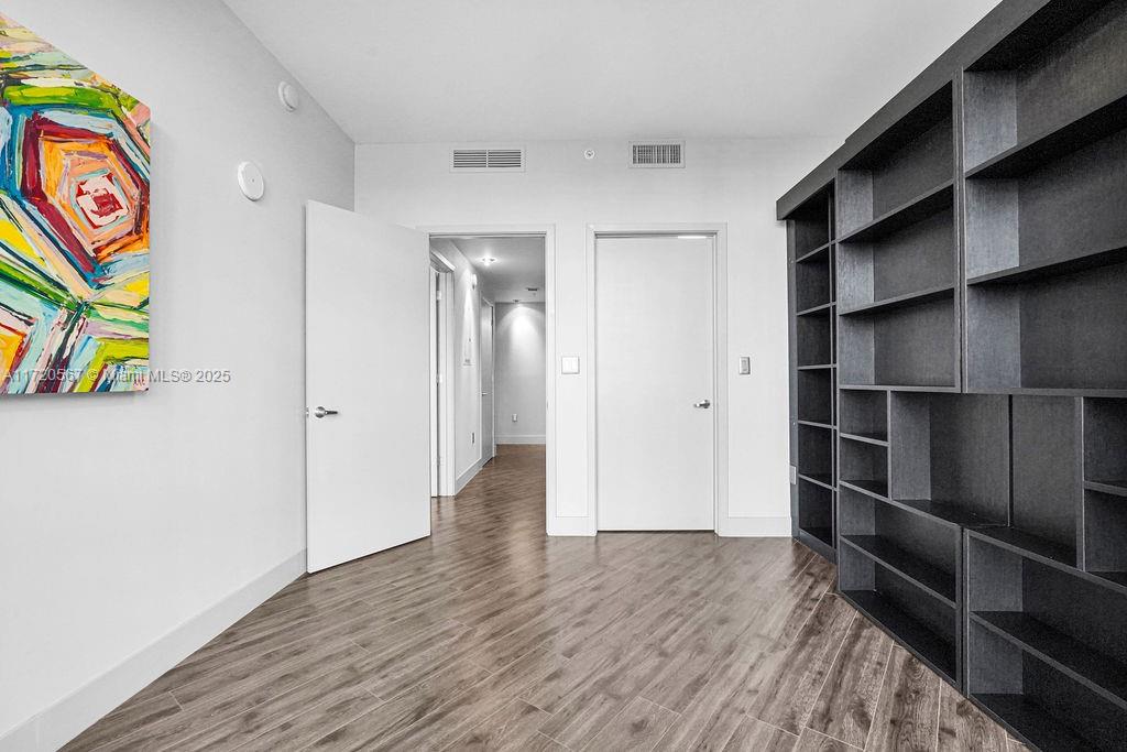 3301 Northeast 1st Avenue, Unit M0404 Miami, FL 33137 - Photo 25 of 68 a view of walk in closet with empty racks