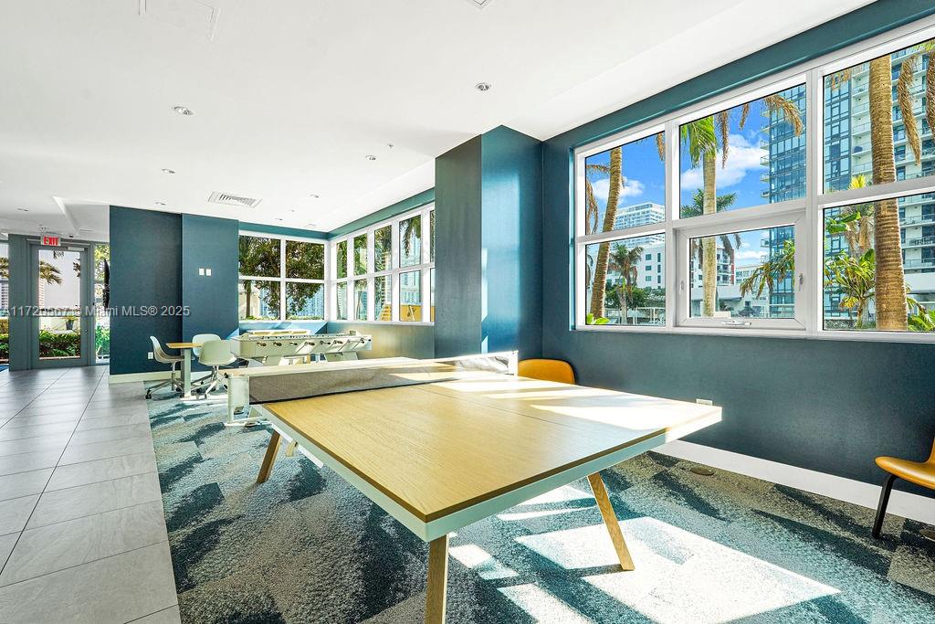 3301 Northeast 1st Avenue, Unit M0404 Miami, FL 33137 - Photo 58 of 68 a view of a dining room with furniture window and wooden floor