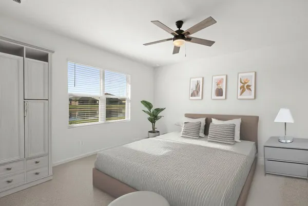 a bedroom with a large bed and a window