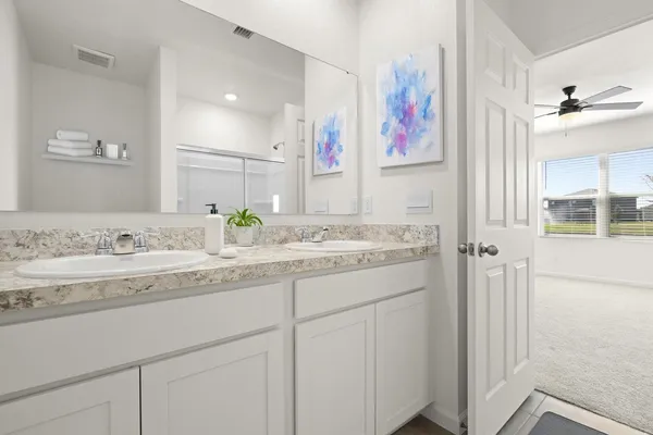 a bathroom with a granite countertop sink mirror and a