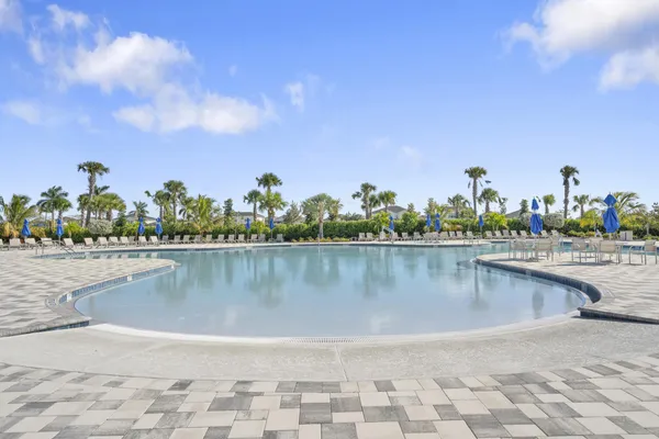 a view of a swimming pool and an outdoor seating