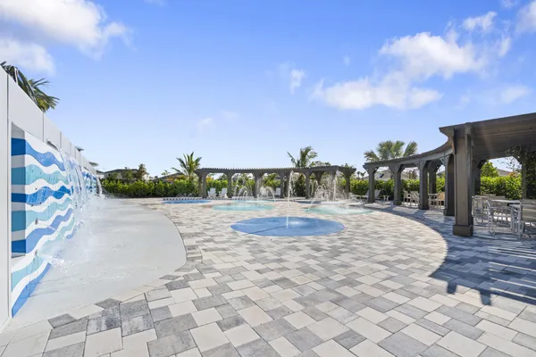 a view of outdoor space with playground and green space