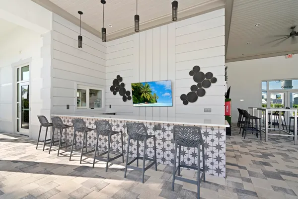 a outdoor space with a table and chairs