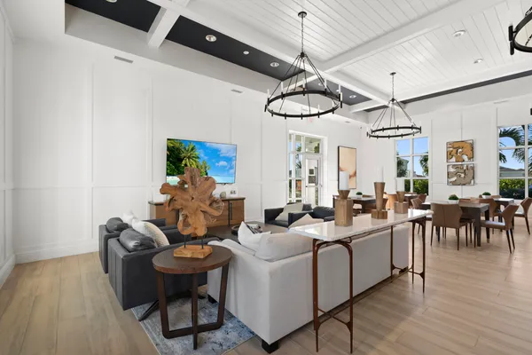 a living room with furniture a window and appliances