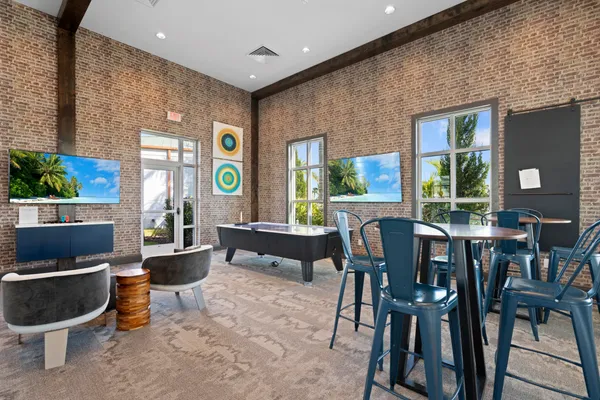 a dining room with furniture and window