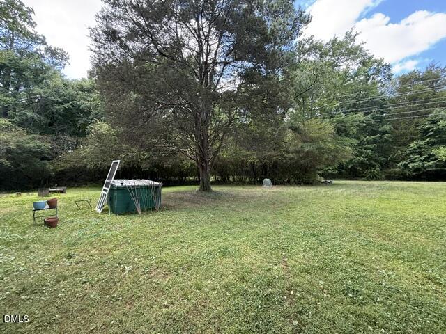 3415 Mt Willing Road Efland, NC 27243 - Photo 32 of 36 a view of backyard with trampoline