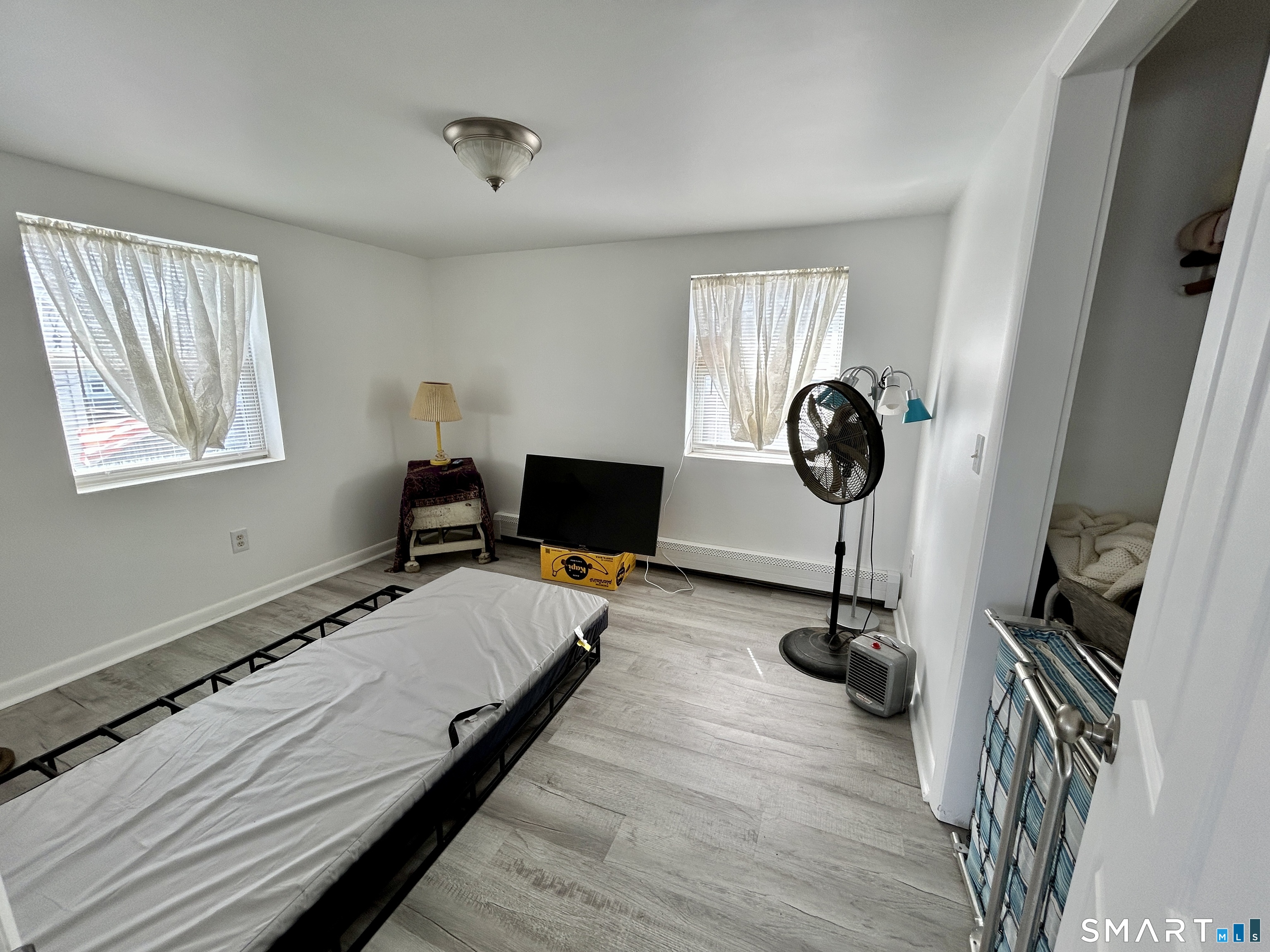 Portland Street Middletown, CT 06457 - Photo 14 of 20 a bedroom with a bed and wooden floor