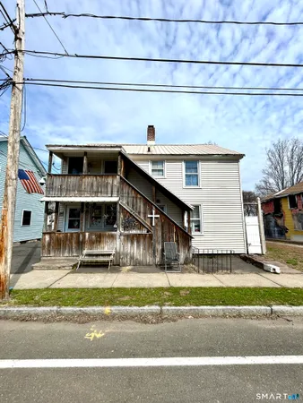 a view of a porch with wooden fence
