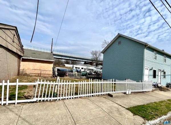 a view of a house with wooden deck