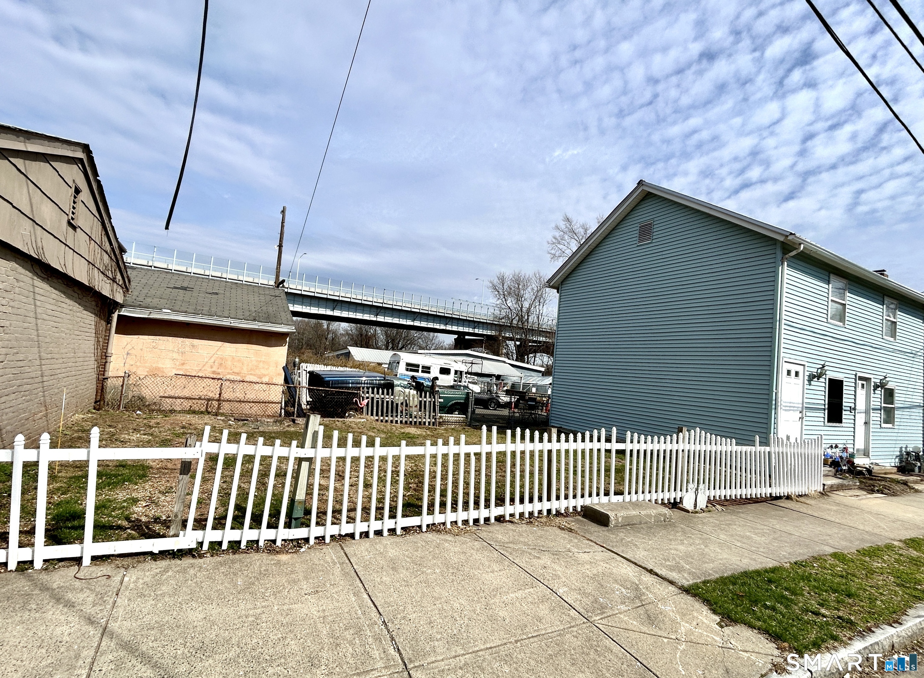 Portland Street Middletown, CT 06457 - Photo 7 of 20 a view of a porch with wooden fence