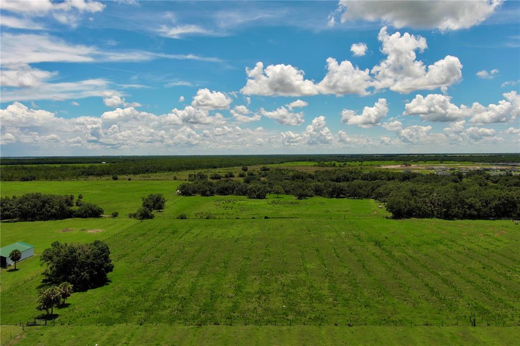 15820 County Road 675 Parrish, FL 34219 - Photo 11 of 14 a view of a big yard with lots of green space