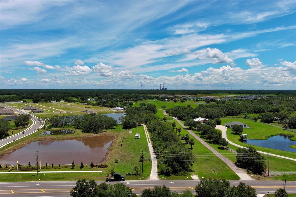 15820 County Road 675 Parrish, FL 34219 - Photo 2 of 14 an aerial view of a houses with outdoor space and city view