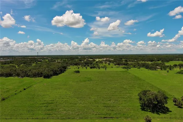 a view of a golf course with a big yard