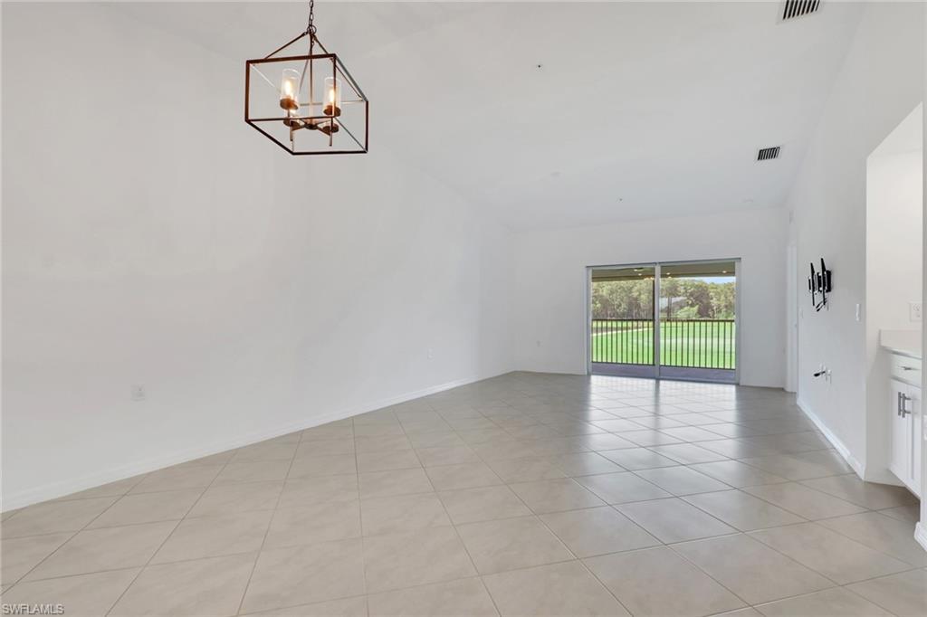 6047 Ellerston Way, Unit 2125 Ave Maria, FL 34142 - Photo 14 of 41 Dining area with living room