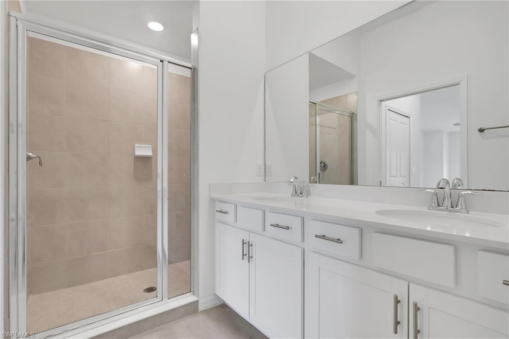 6047 Ellerston Way, Unit 2125 Ave Maria, FL 34142 - Photo 20 of 41 Main Bathroom with dual sinks, quartz counter top