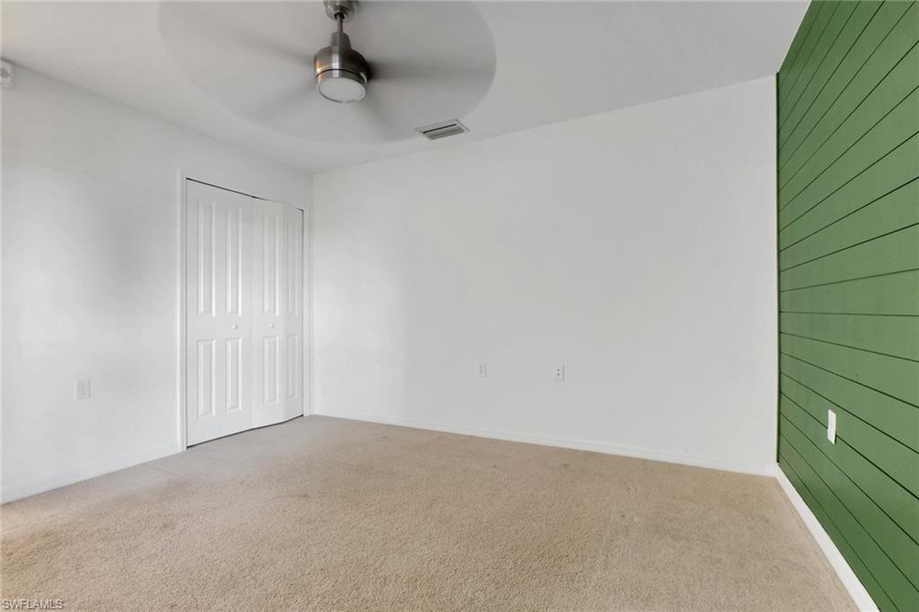 6047 Ellerston Way, Unit 2125 Ave Maria, FL 34142 - Photo 22 of 41 2nd bedroom with accent wall