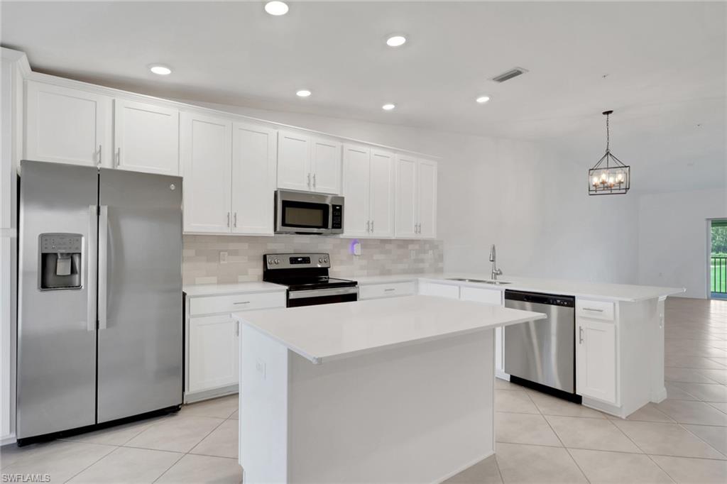 6047 Ellerston Way, Unit 2125 Ave Maria, FL 34142 - Photo 9 of 41 Kitchen with island