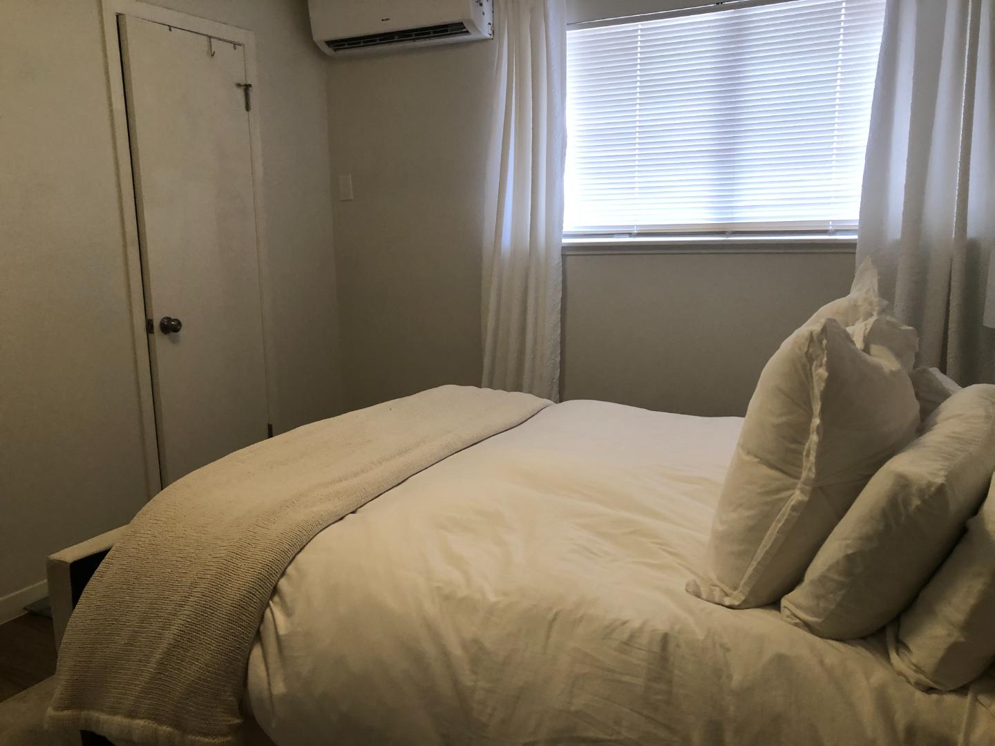 1915 Fairlawn Lane, Unit 2 Austin, TX 78704 - Photo 10 of 12 Bedroom with a wall mounted AC