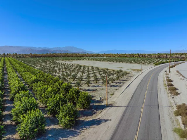 a view of a road with a yard