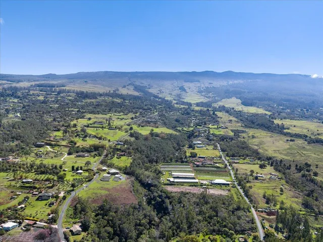 an aerial view of residential house and outdoor space