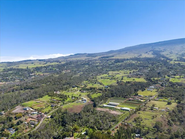 a view of a city with mountains in the background