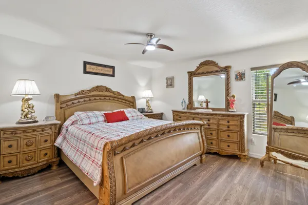 a bedroom with a bed and a dresser