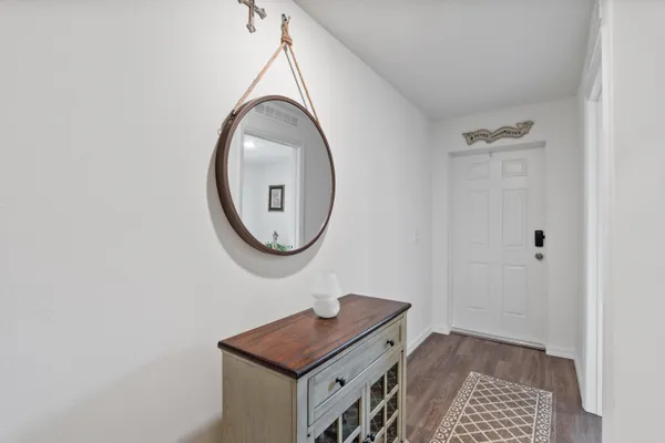 a room with a table and a mirror