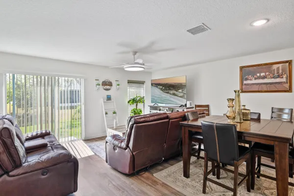 a view of a dining room with furniture window and outside view