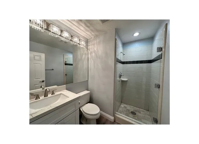 a open hall with furniture and a fireplace