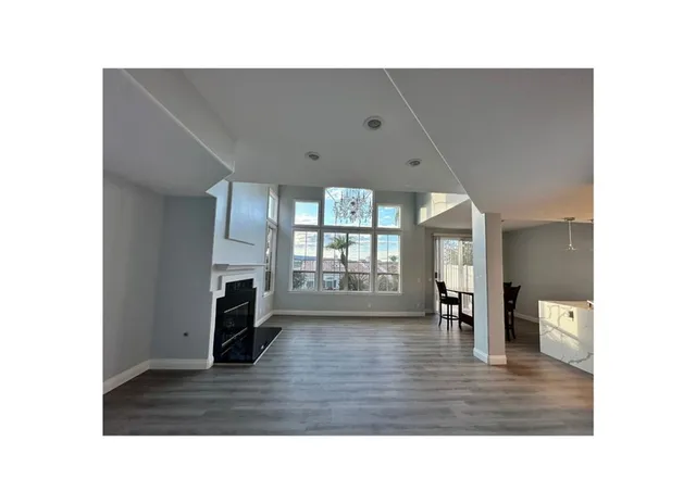 a room with furniture and a large window