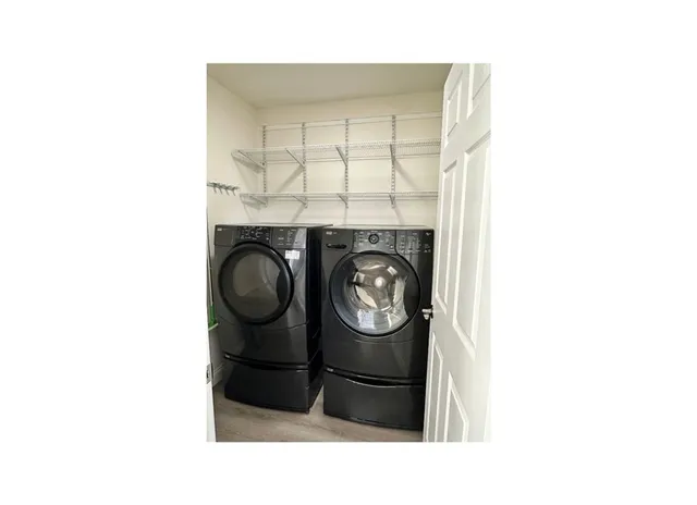 a black and white photo of a bathroom