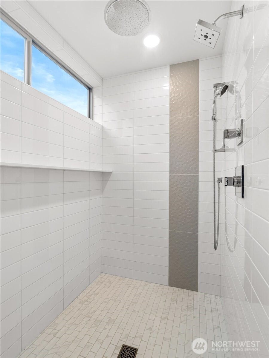 5017 Fauntleroy Way Southwest, Unit B Seattle, WA 98136 - Photo 14 of 24 a bathroom with a shower