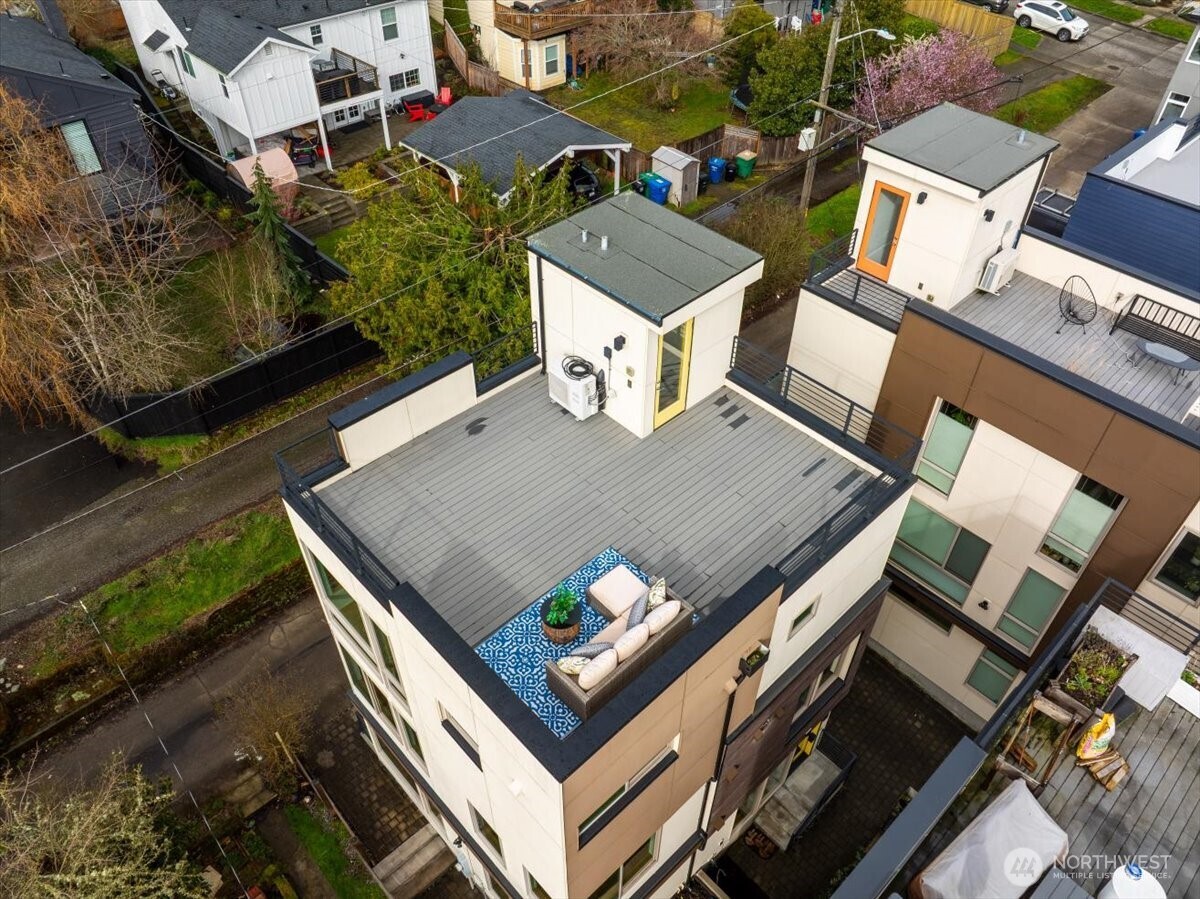 5017 Fauntleroy Way Southwest, Unit B Seattle, WA 98136 - Photo 2 of 24 an aerial view of a house with a swimming pool