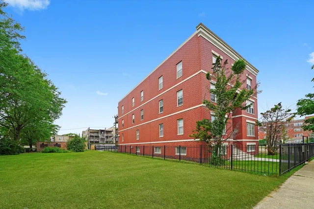 a front view of a building with garden