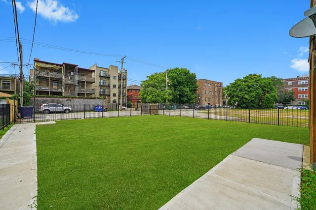 a view of a garden and a building in the background