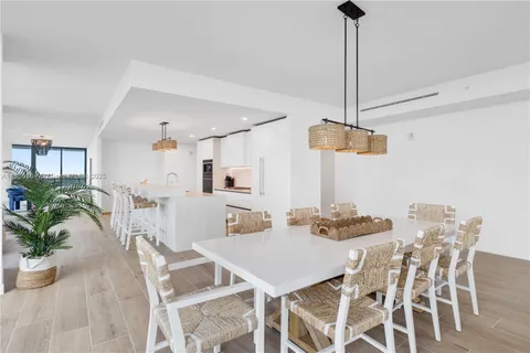 a bedroom with a bed and painting on the wall