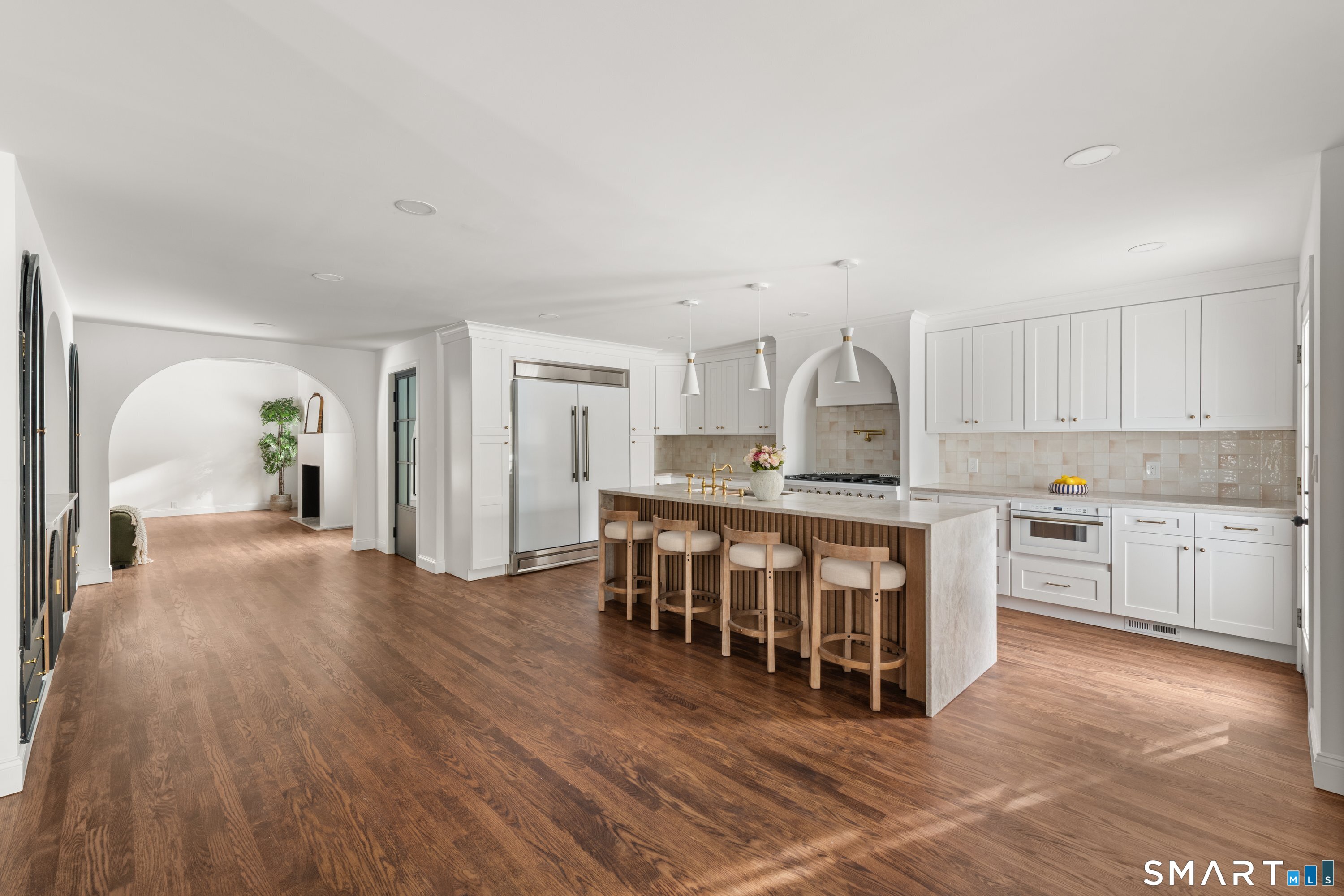 913 Ridgefield Road Wilton, CT 06897 - Photo 16 of 40 a large white kitchen with a large window