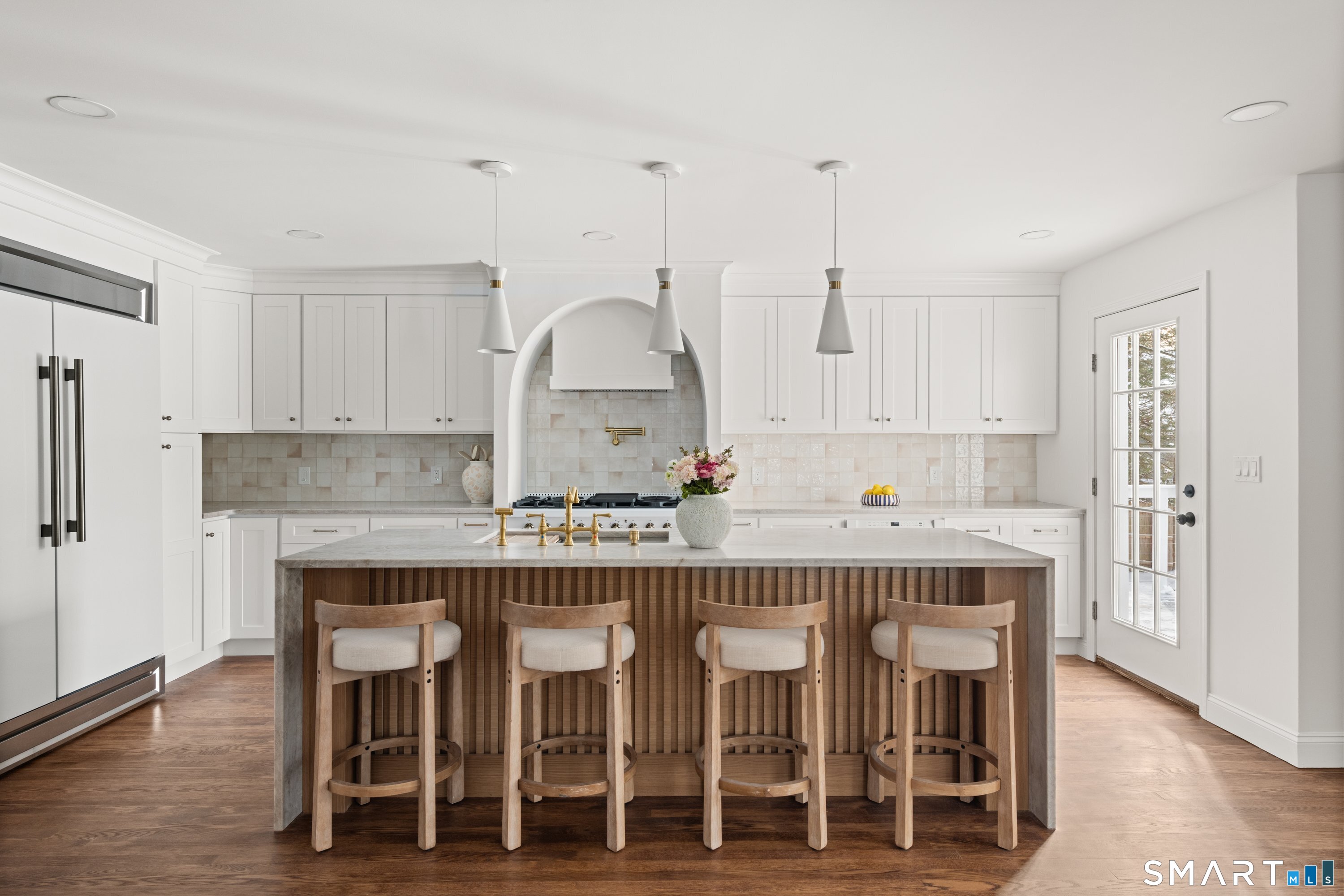 913 Ridgefield Road Wilton, CT 06897 - Photo 18 of 40 a view of kitchen with granite countertop center island and stainless steel appliances