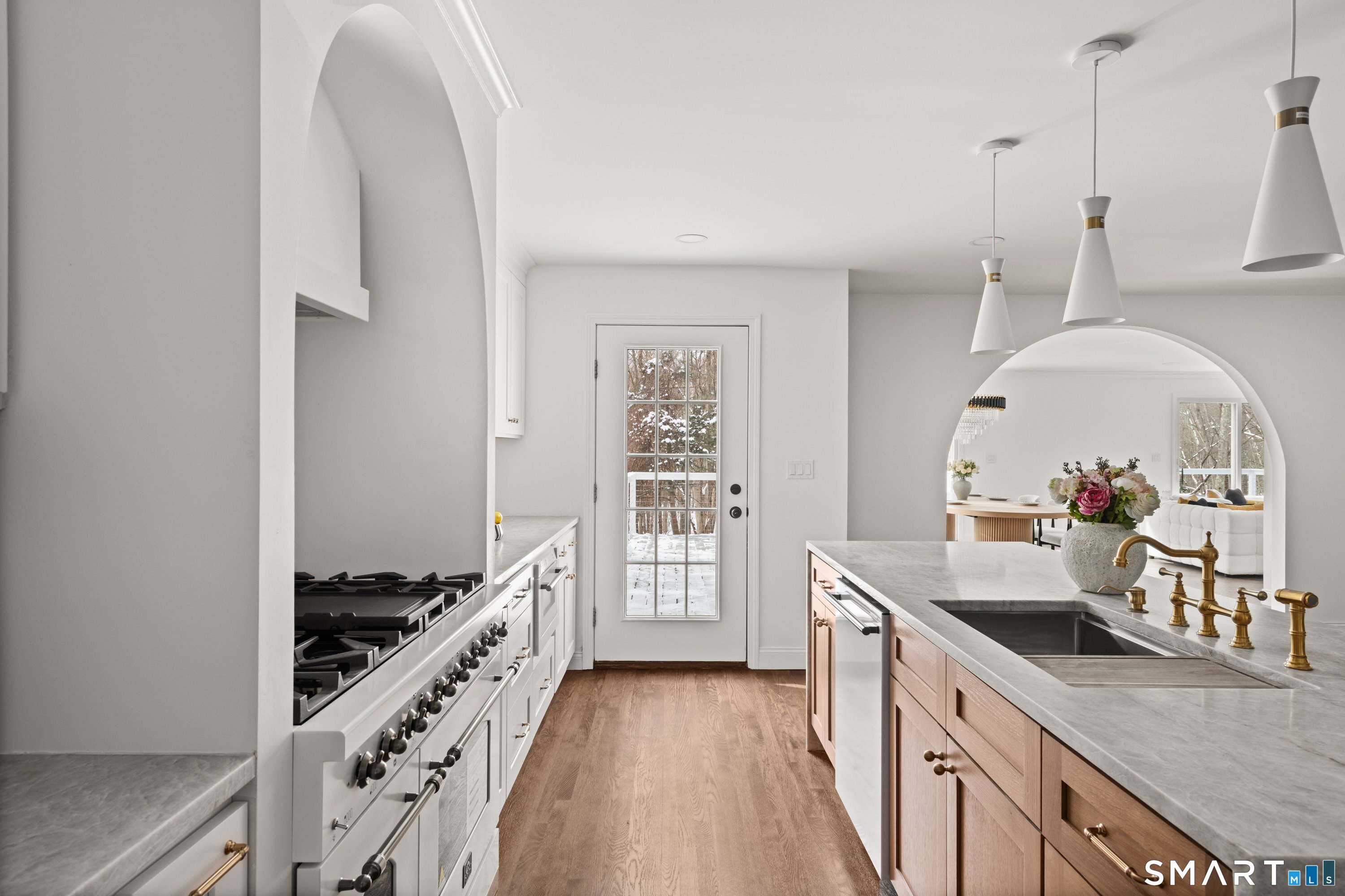 913 Ridgefield Road Wilton, CT 06897 - Photo 19 of 40 a kitchen with sink a stove and cabinets