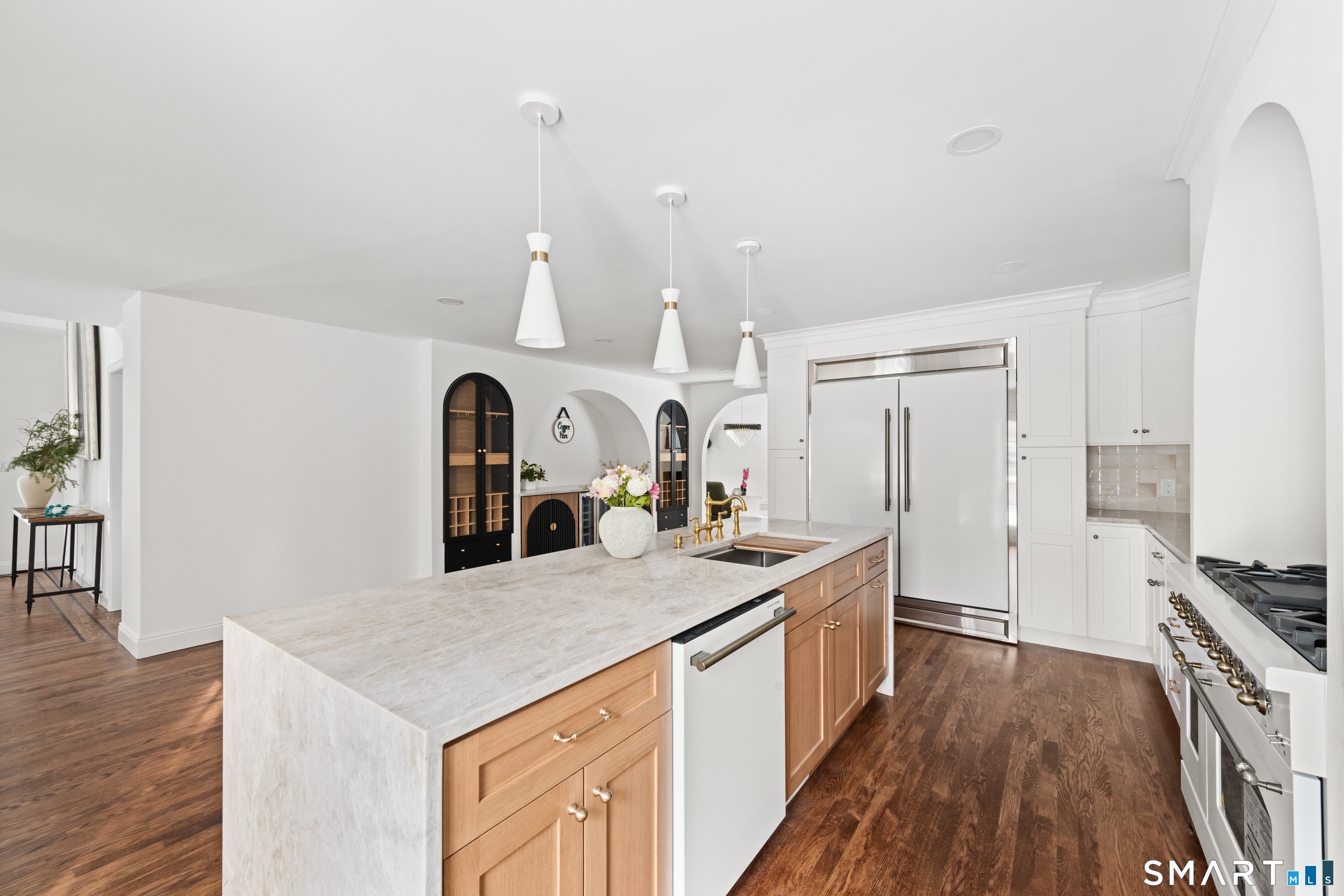 913 Ridgefield Road Wilton, CT 06897 - Photo 20 of 40 a kitchen with a stove and a wooden floor