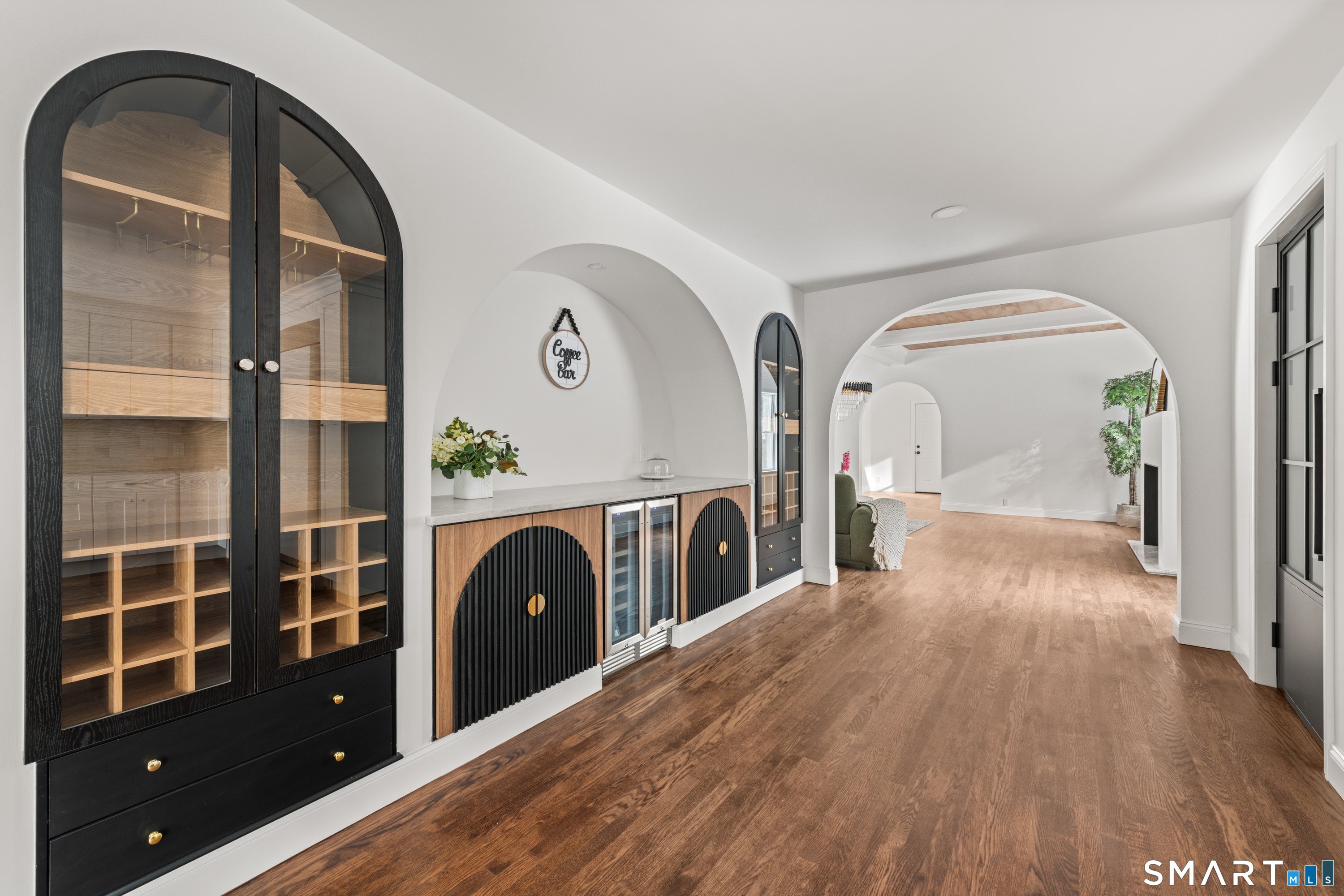 913 Ridgefield Road Wilton, CT 06897 - Photo 21 of 40 a view of a hallway with wooden floor and entryway