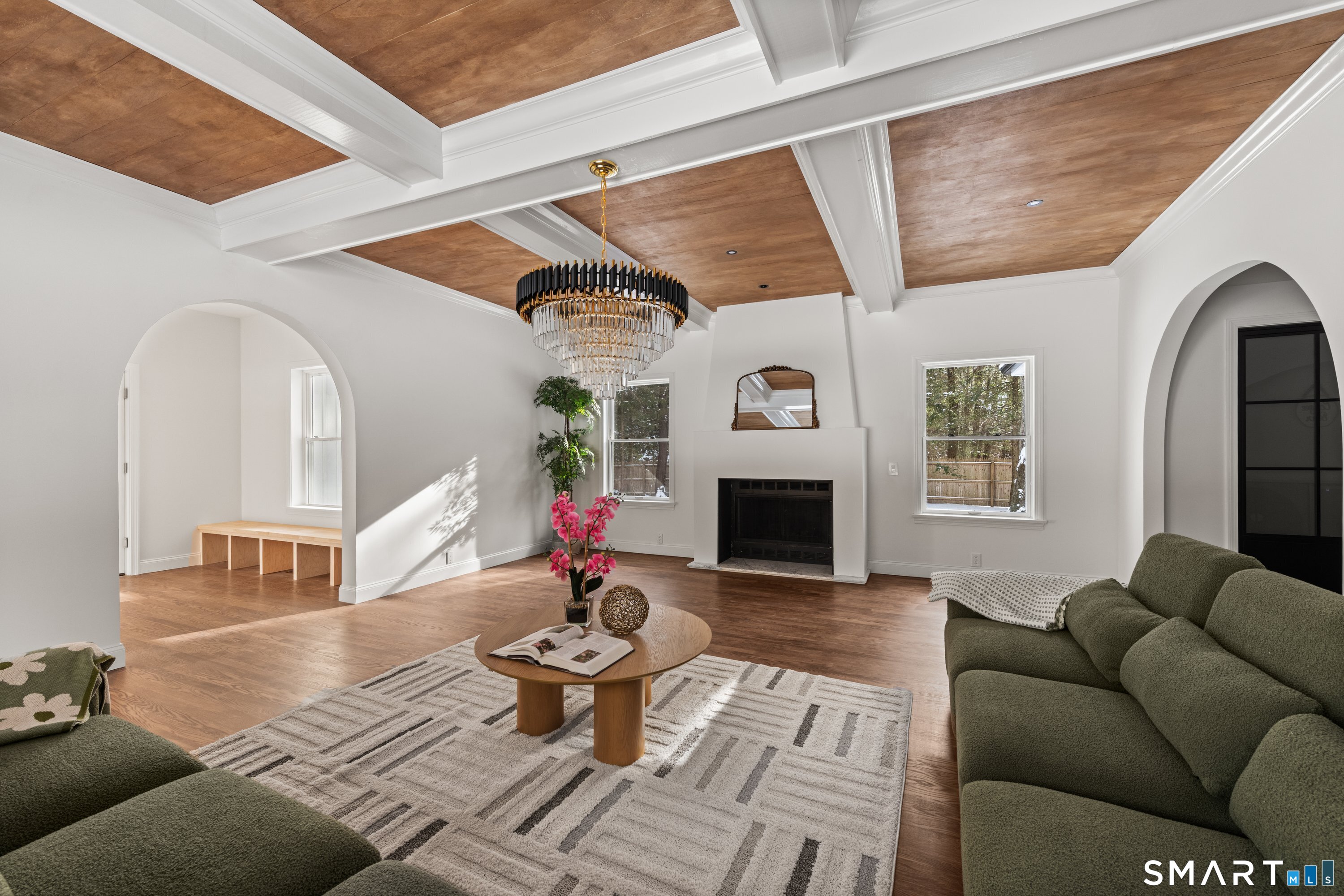 913 Ridgefield Road Wilton, CT 06897 - Photo 22 of 40 a living room with furniture and a fireplace