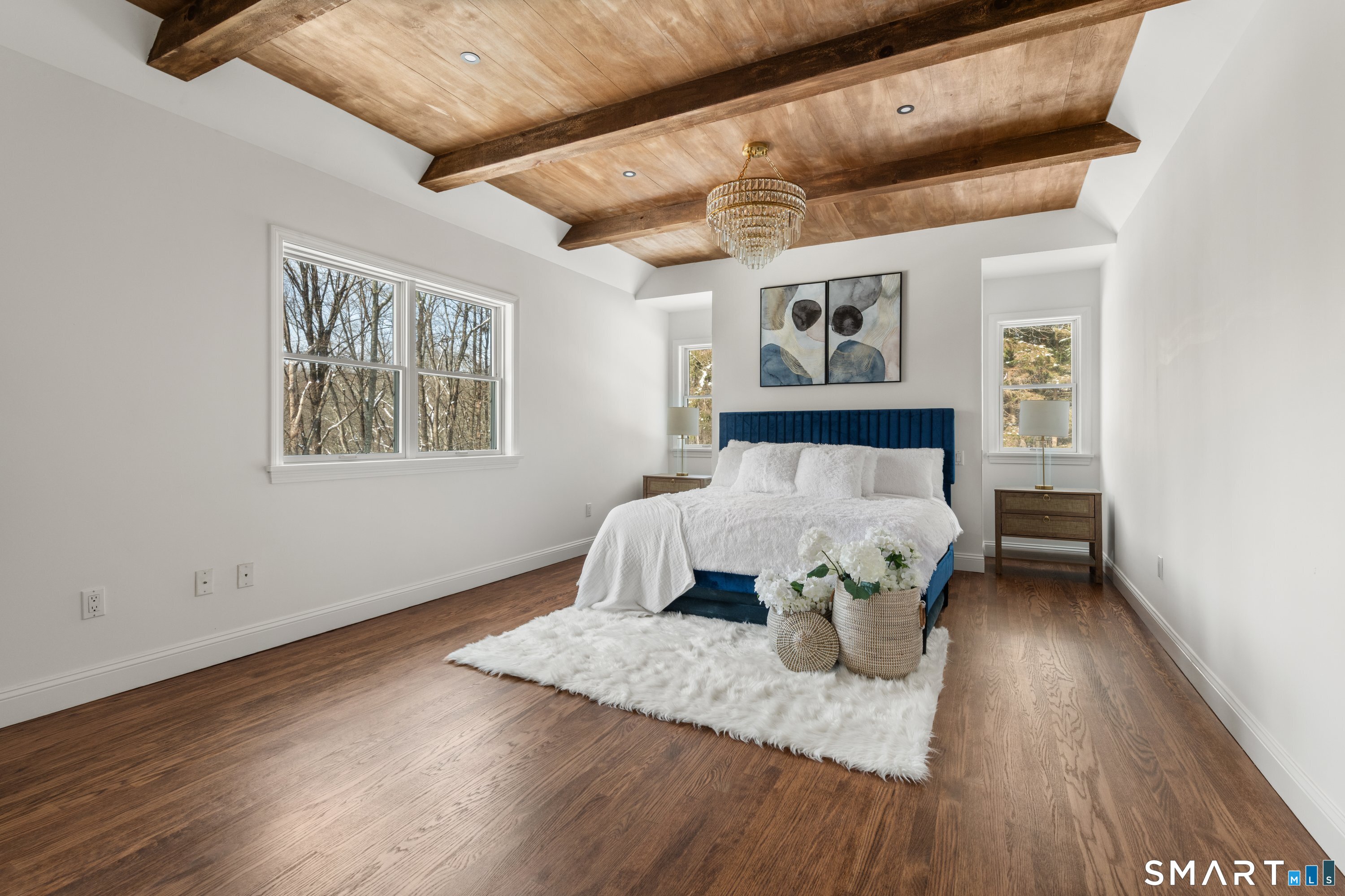 913 Ridgefield Road Wilton, CT 06897 - Photo 27 of 40 a bed sitting in a bedroom next to a window