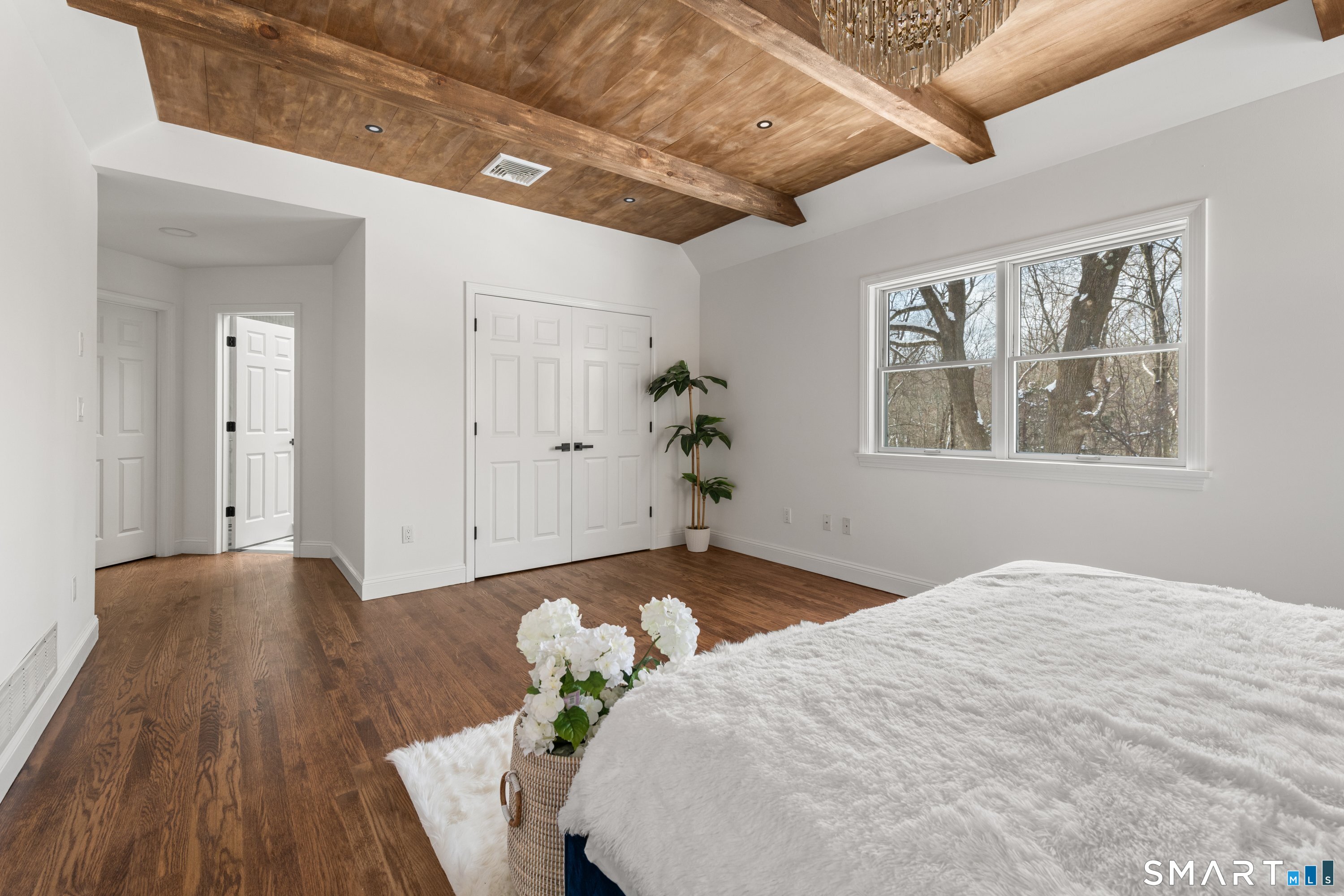 913 Ridgefield Road Wilton, CT 06897 - Photo 28 of 40 a bed sitting in a bedroom next to a window