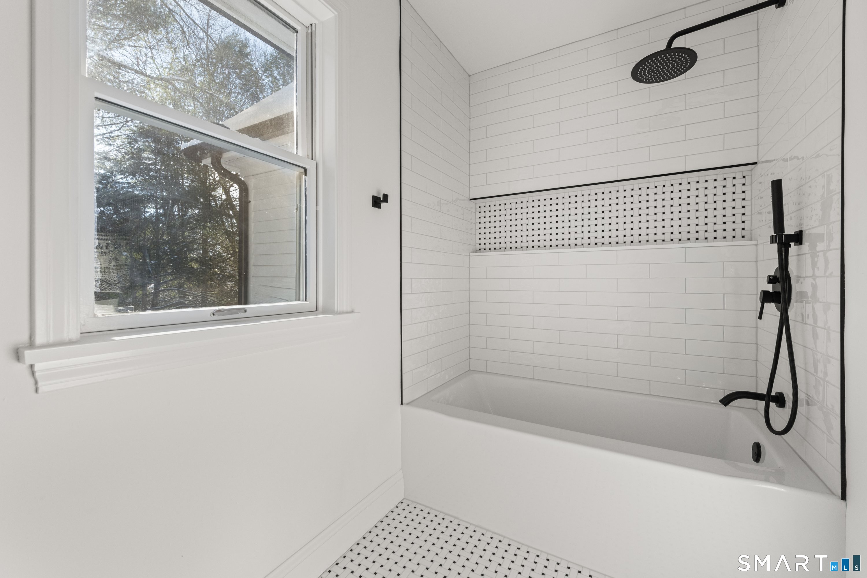 913 Ridgefield Road Wilton, CT 06897 - Photo 32 of 40 a bathroom with a granite countertop window and a shower