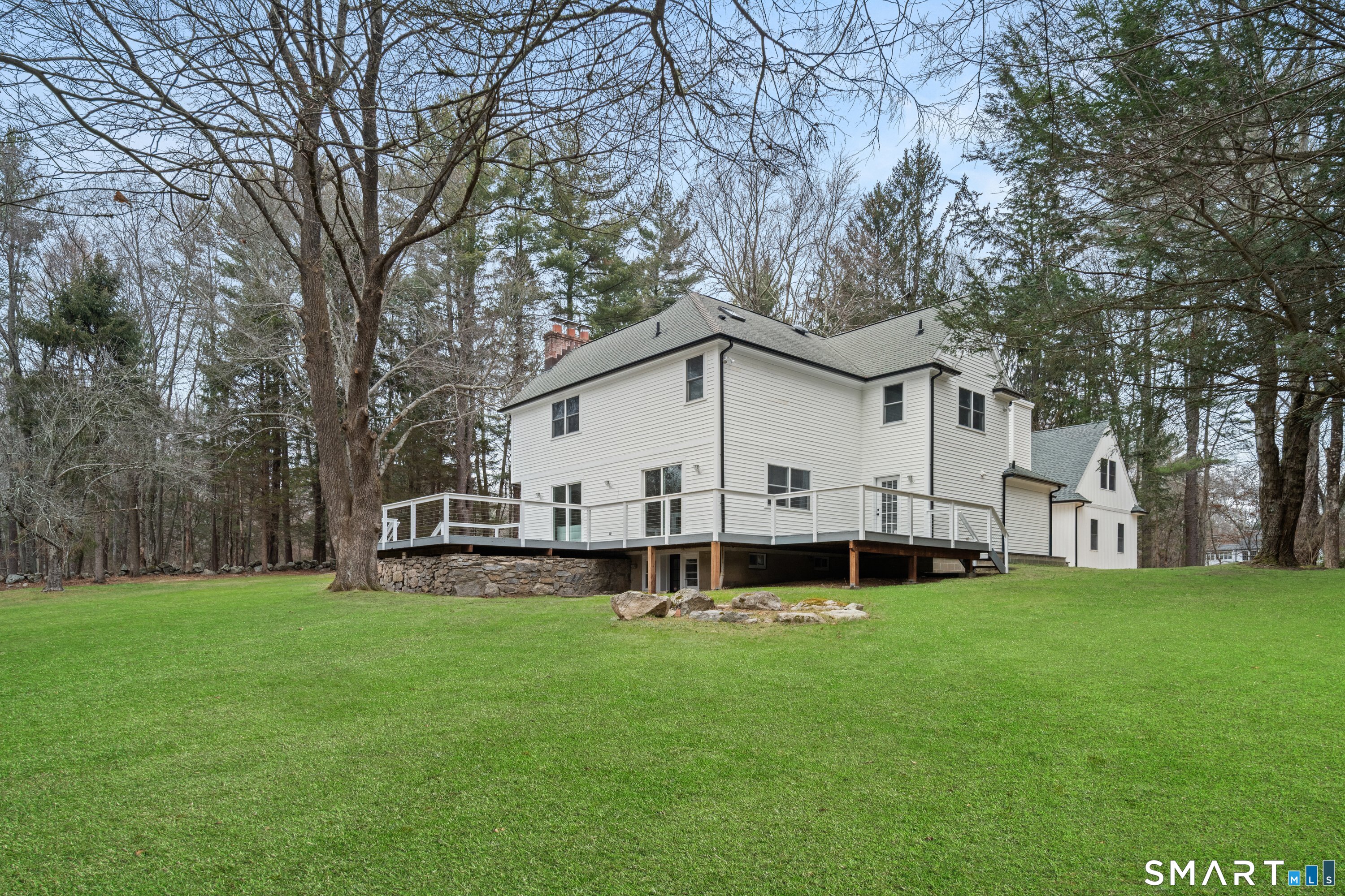913 Ridgefield Road Wilton, CT 06897 - Photo 6 of 40 a view of a house with a yard and sitting area