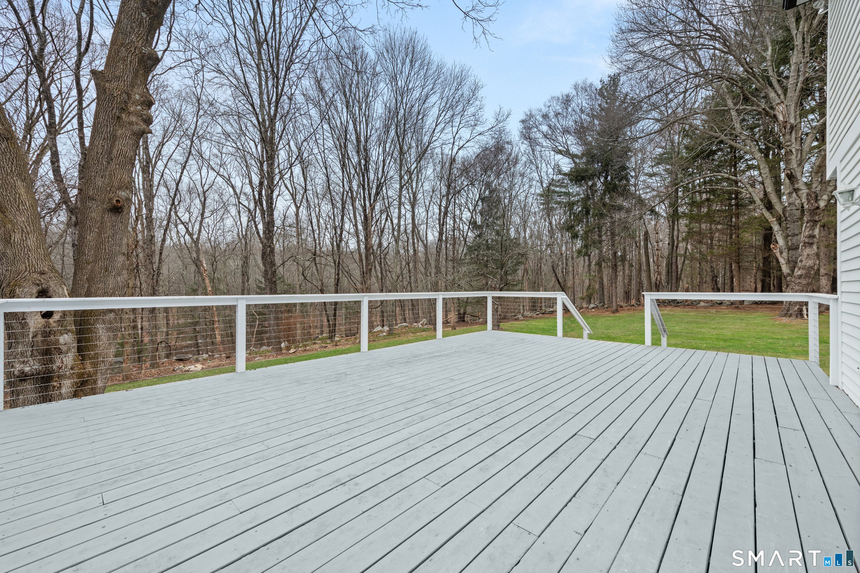 913 Ridgefield Road Wilton, CT 06897 - Photo 8 of 40 a view of a wooden deck
