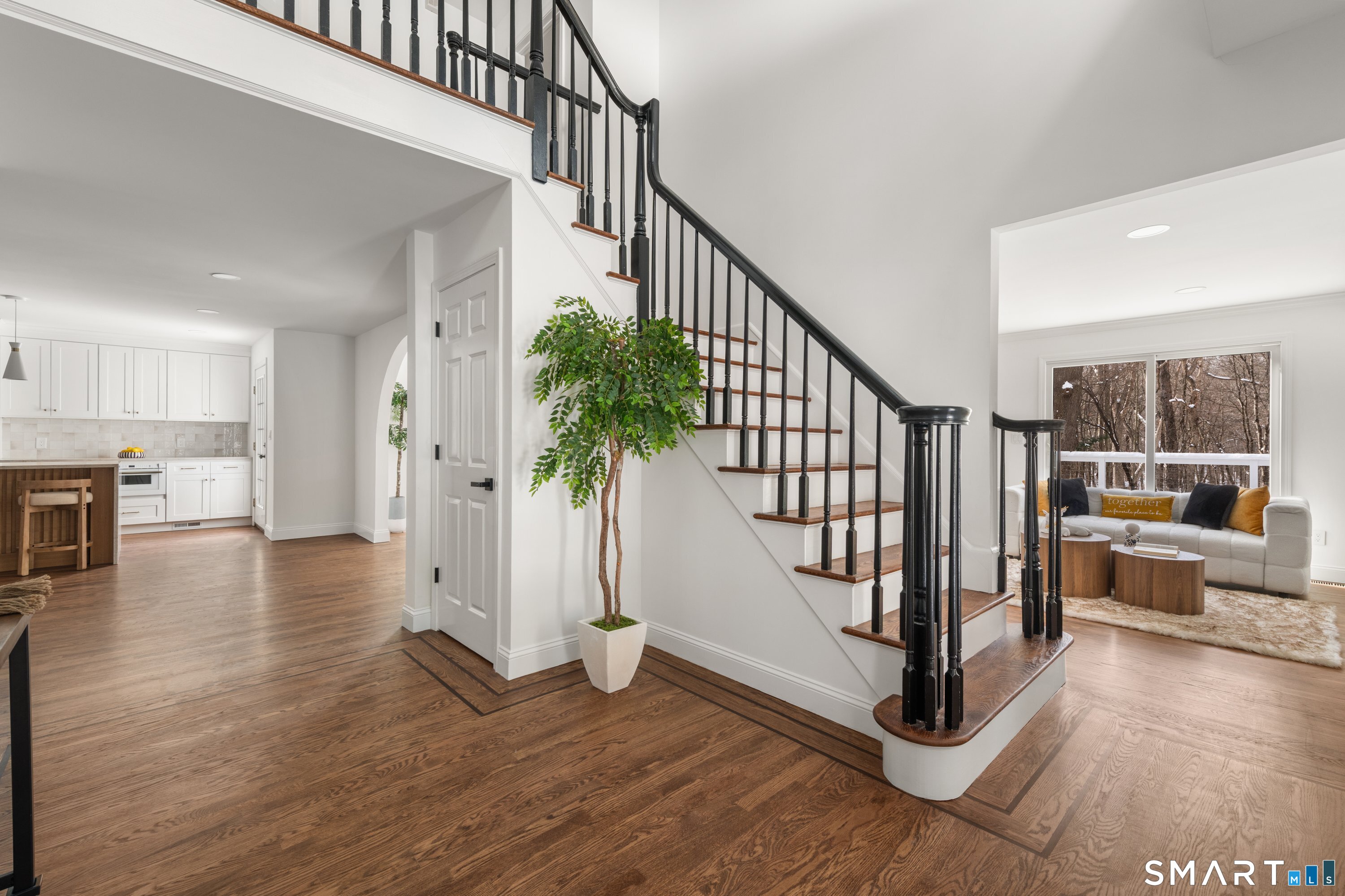 913 Ridgefield Road Wilton, CT 06897 - Photo 9 of 40 a view of entryway and hall with wooden floor