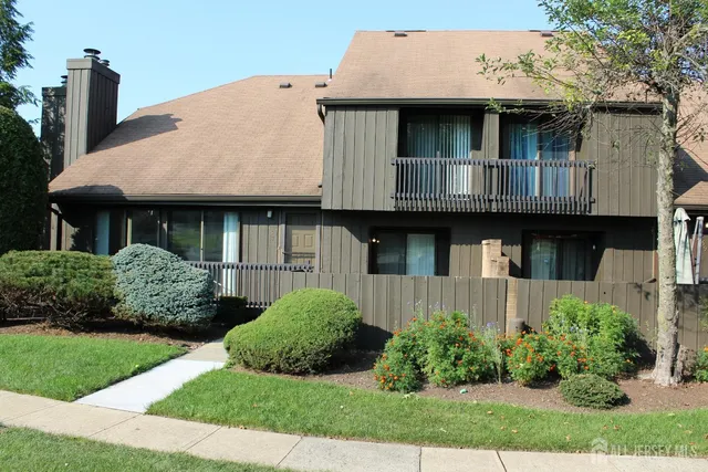 a view of a house with garden and plants